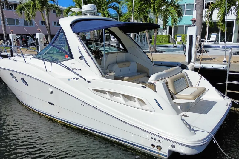 Slide: The Image of 2008 Sea Ray Sundancer 330 docked, featuring sleek design and spacious seating. - 59