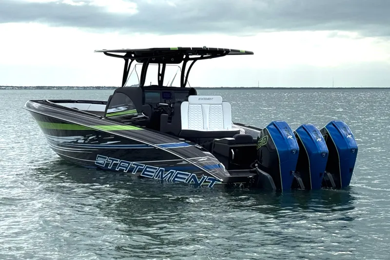 The Image of 2024 Statement 350 Open boat with triple engines on calm water. - 0