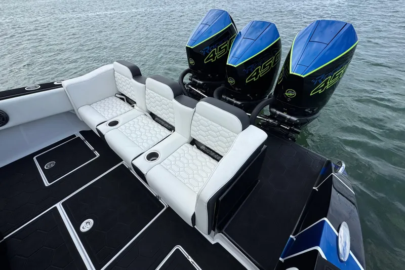 Slide: The Image of 2024 Statement 350 Open boat with triple outboard engines and luxurious seating. - 12