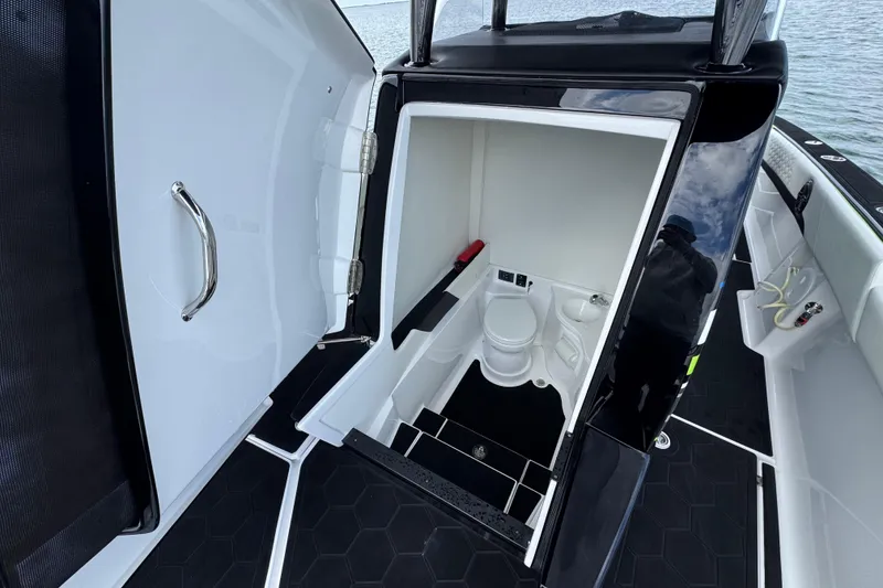 Slide: The Image of 2024 Statement 350 Open boat interior with compact bathroom and modern design. - 15