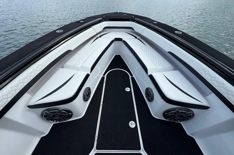 Slide: The Image of 2024 Statement 350 Open boat interior with sleek white seating and modern design. - 19