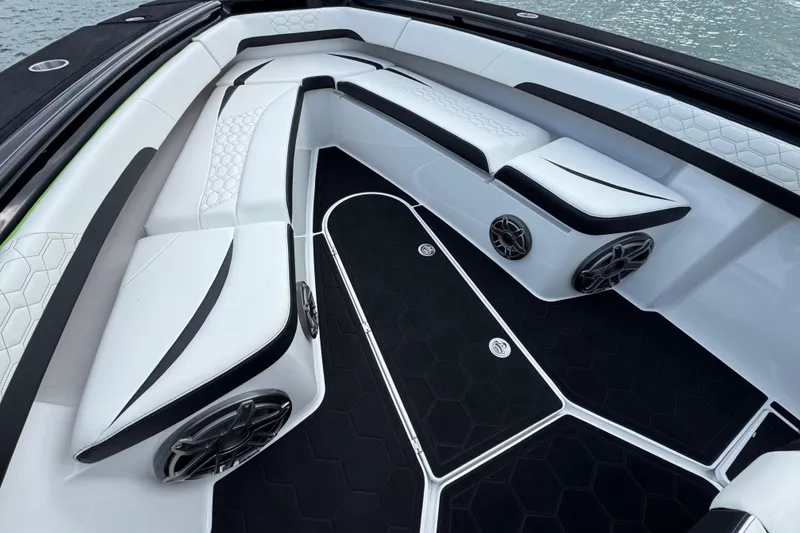 Slide: The Image of 2024 Statement 350 Open boat interior with sleek white seating and modern design. - 20