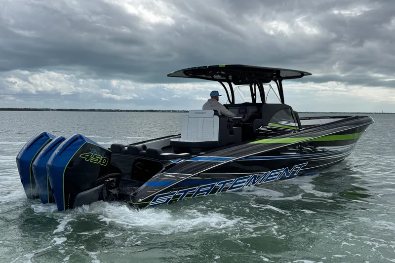 Slide: The Image of 2024 Statement 350 Open boat cruising on water under cloudy skies. - 3