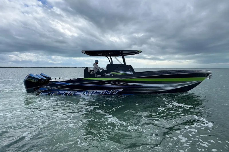 Slide: The Image of 2024 Statement 350 Open boat cruising on water under cloudy skies. - 4