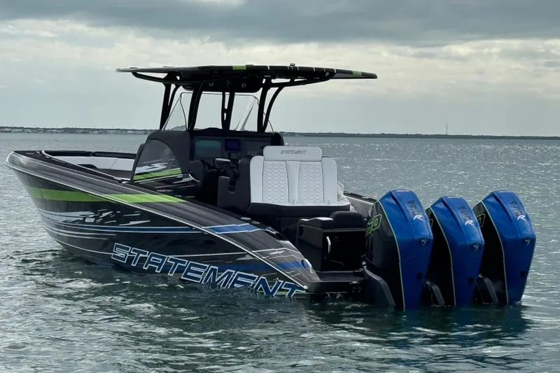 Slide: The Image of 2024 Statement 350 Open boat with triple outboard engines on calm water. - 6