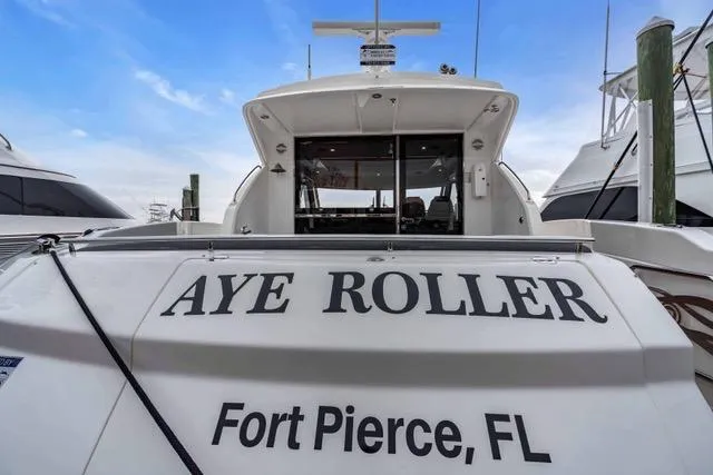 Slide: The Image of 2014 Riviera 4400 Sport Yacht "Aye Roller" docked in Fort Pierce, FL. - 18