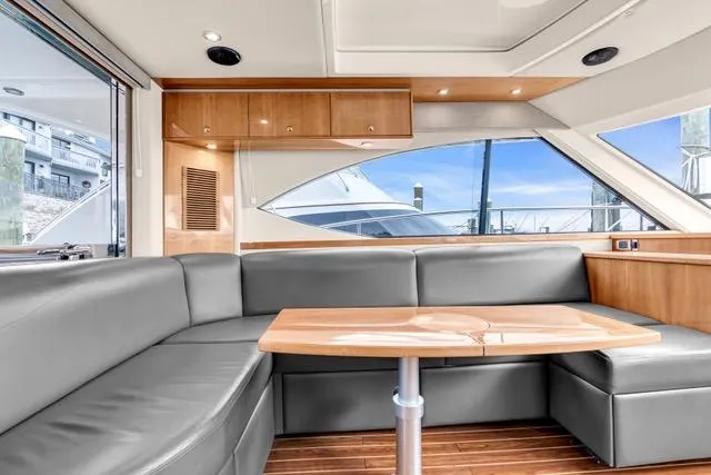 Slide: The Image of Luxurious interior of 2014 Riviera 4400 Sport Yacht with sleek seating and wooden accents. - 38