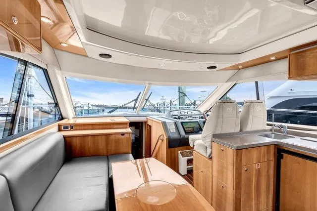 Slide: The Image of Interior of 2014 Riviera 4400 Sport Yacht with luxurious wood finish and modern design. - 41