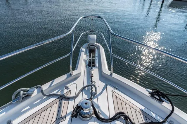 Slide: The Image of Bow view of 2014 Riviera 4400 Sport Yacht on calm water. - 71