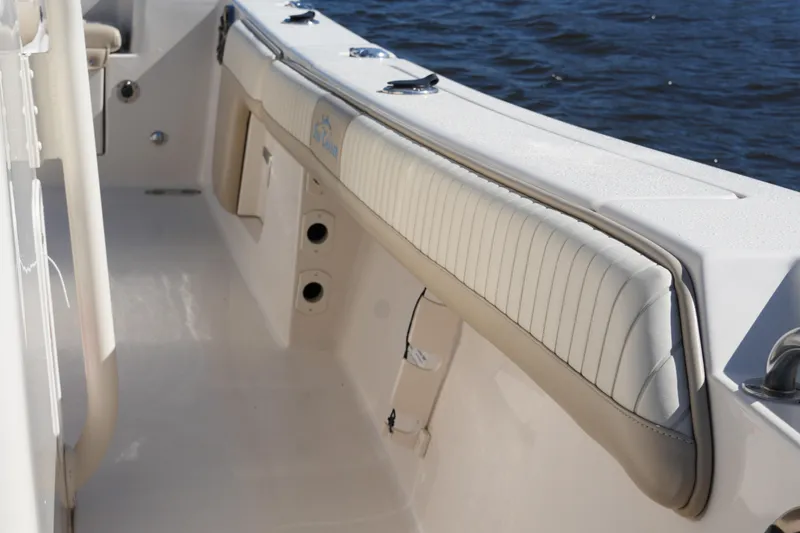 Slide: The Image of 2019 SeaChaser 24 HFC boat interior with cushioned seating and storage compartments. - 14