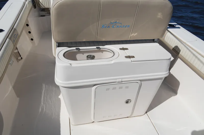 Slide: The Image of 2019 SeaChaser 24 HFC boat interior with storage compartment and seating. - 17