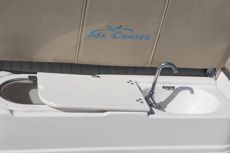 Slide: The Image of 2019 SeaChaser 24 HFC boat sink and cutting board detail. - 19