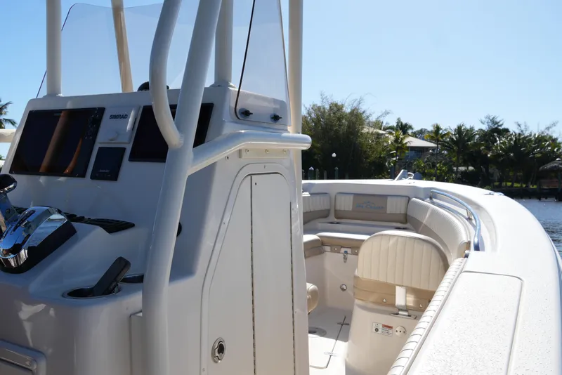 Slide: The Image of 2019 SeaChaser 24 HFC boat interior with helm and seating area. - 29