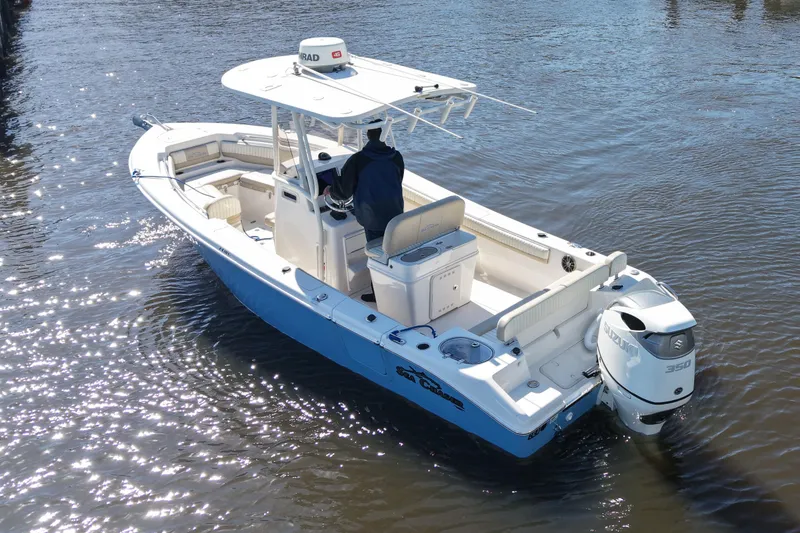 Slide: The Image of 2019 SeaChaser 24 HFC boat on water, featuring Suzuki 350 outboard engine. - 4