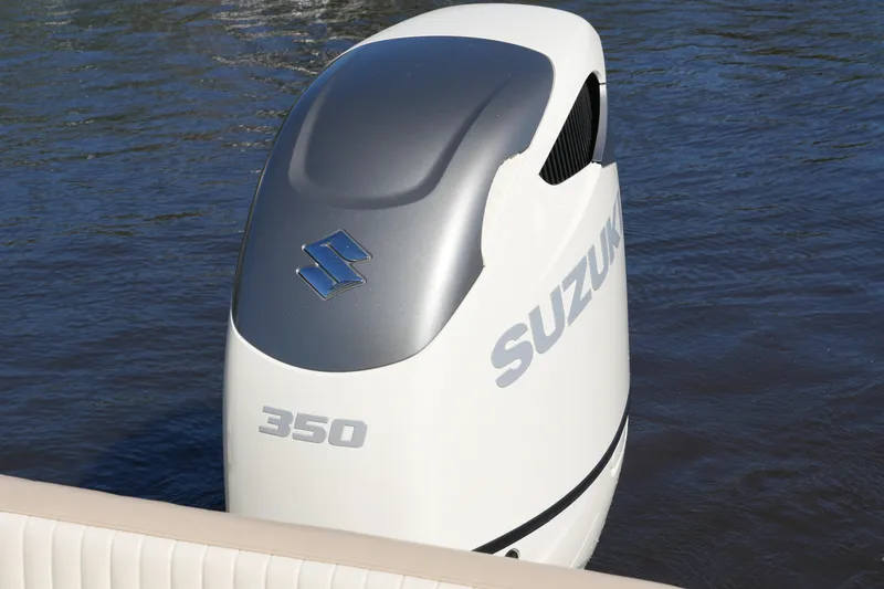Slide: The Image of Suzuki 350 outboard motor on 2019 SeaChaser 24 HFC boat, water background. - 44