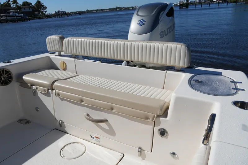 Slide: The Image of 2019 SeaChaser 24 HFC boat interior with seating and Suzuki outboard motor. - 16