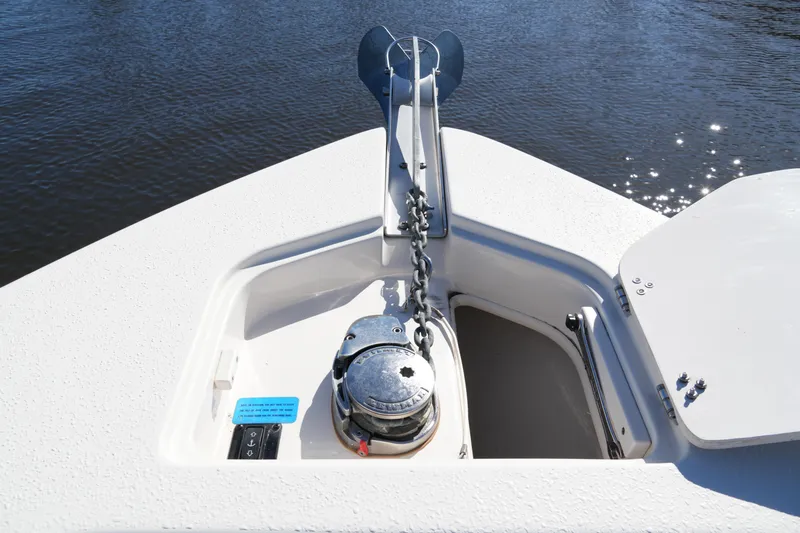 Slide: The Image of 2019 SeaChaser 24 HFC boat anchor system on calm water. - 23