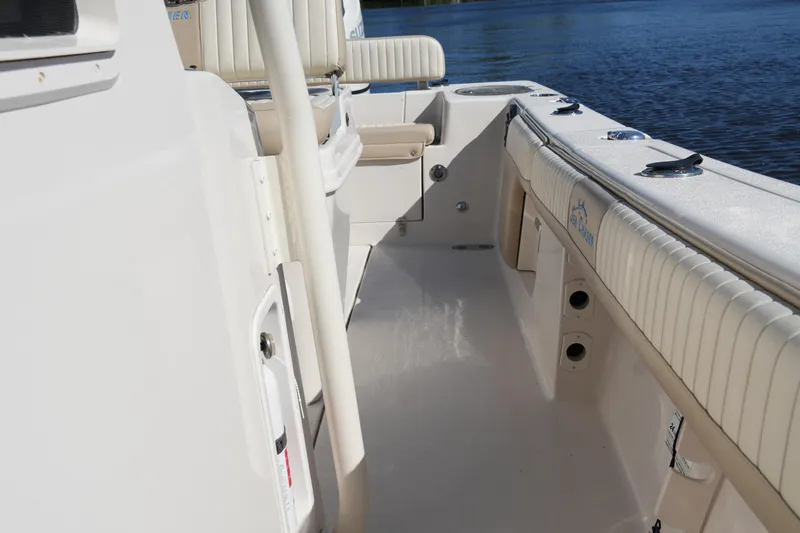Slide: The Image of 2019 SeaChaser 24 HFC boat interior with seating and water view. - 37