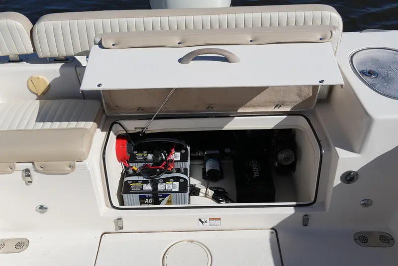 Slide: The Image of 2019 SeaChaser 24 HFC boat battery compartment with dual batteries and wiring. - 41