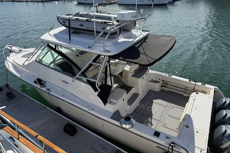 The Image of 2006 Grady-White Express 360 boat docked, featuring spacious deck and modern equipment. - 0