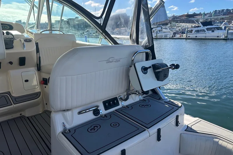 Slide: The Image of 2006 Grady-White Express 360 boat interior with seating and control panel, docked at marina. - 10