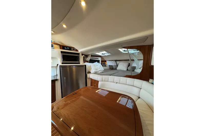 Slide: The Image of Luxurious interior of 2006 Grady-White Express 360 boat with seating and kitchenette. - 16