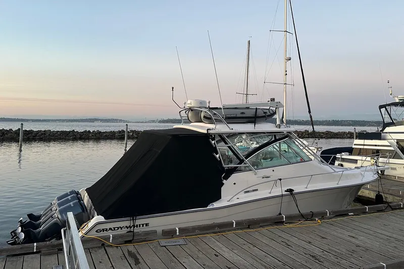 Slide: The Image of 2006 Grady-White Express 360 boat docked at marina during sunset. - 2