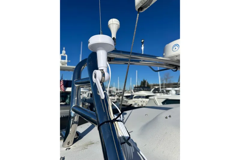 Slide: The Image of Close-up of 2006 Grady-White Express 360 boat's antenna and railing under clear blue sky. - 4