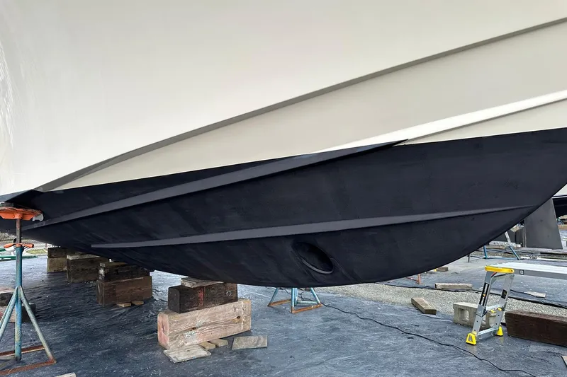 Slide: The Image of 2006 Grady-White Express 360 boat hull on supports, undergoing maintenance. - 5