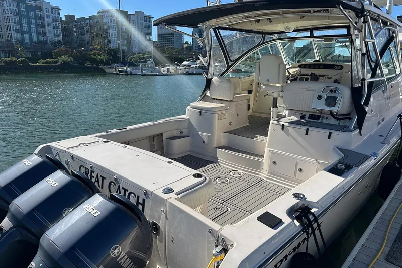 Slide: The Image of 2006 Grady-White Express 360 boat docked, featuring spacious deck and dual Yamaha engines. - 6