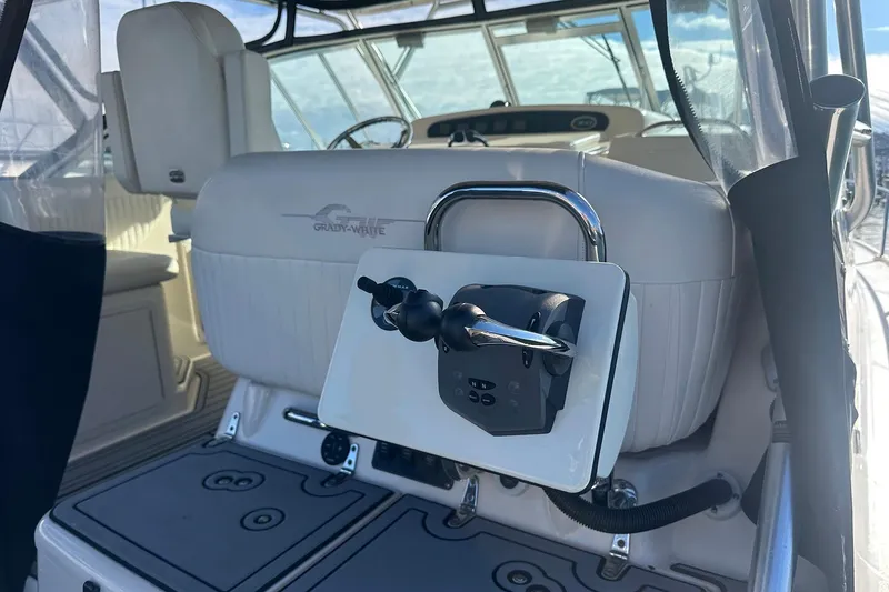 Slide: The Image of 2006 Grady-White Express 360 boat interior with steering controls and seating. - 7