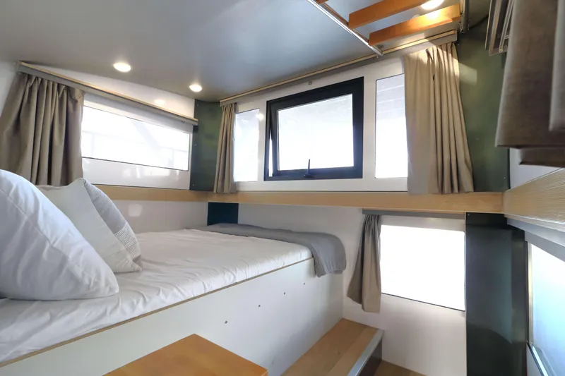 Slide: The Image of Modern Navisyo Homes NV.08 bedroom interior, 2021 model, featuring cozy bed and natural lighting. - 11