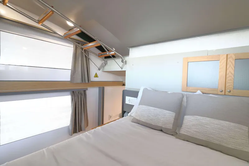 Slide: The Image of Modern bedroom interior in Navisyo Homes NV.08, 2021 model, featuring sleek design and cozy bedding. - 12