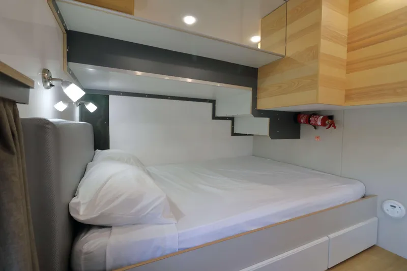 Slide: The Image of Modern Navisyo Homes NV.08 bedroom interior, 2021 model, featuring sleek design and compact storage. - 16