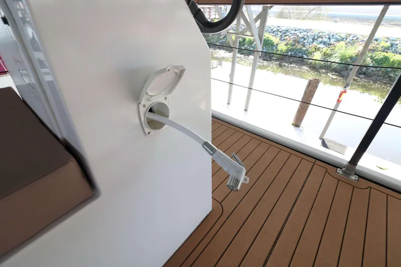 Slide: The Image of Navisyo Homes NV.08 2021 model with hose connection on deck. - 24