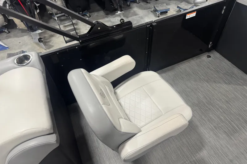 Slide: The Image of 2022 Lowe SS 270 boat interior with gray seating and cup holder. - 11