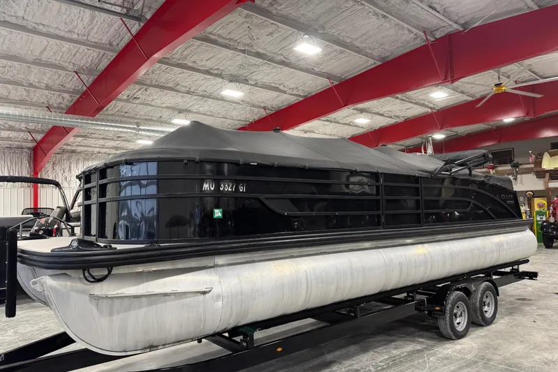 Slide: The Image of 2022 Lowe SS 270 pontoon boat with cover in indoor storage facility. - 14