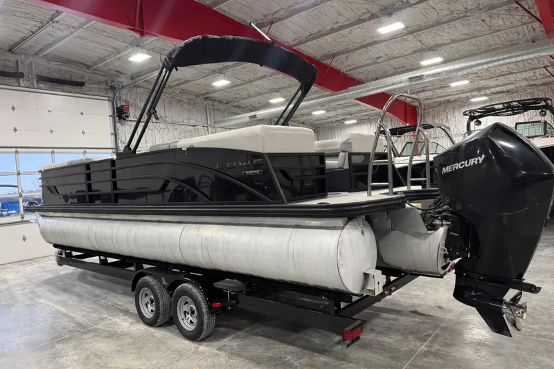 Slide: The Image of 2022 Lowe SS 270 pontoon boat with Mercury engine in a showroom. - 3