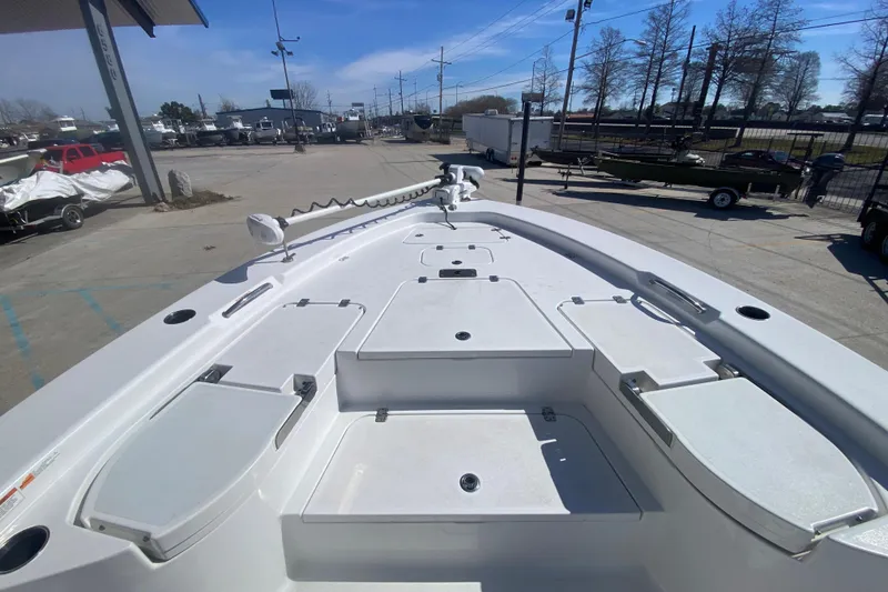 Slide: The Image of 2021 Sportsman Masters 267 Bay Boat deck with storage compartments and trolling motor. - 12