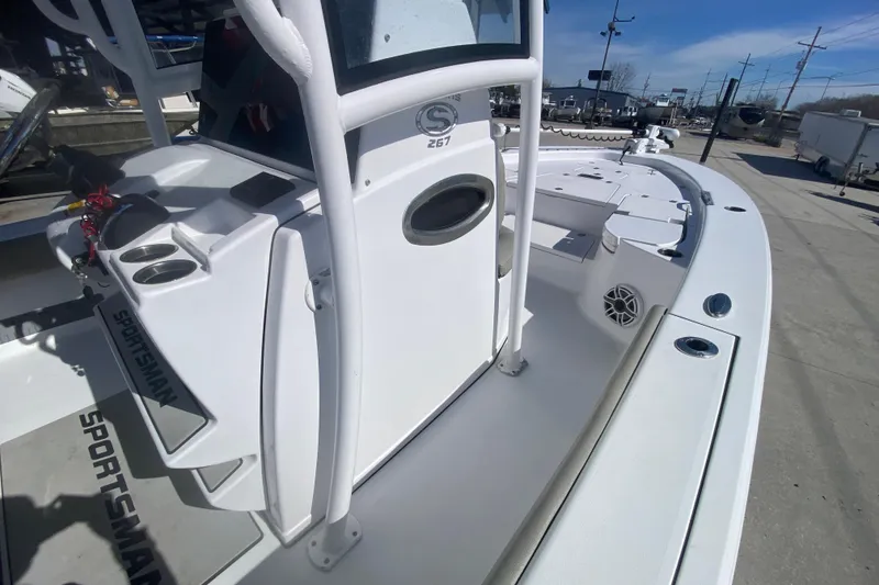 Slide: The Image of 2021 Sportsman Masters 267 Bay Boat, white deck, console, and seating area. - 15