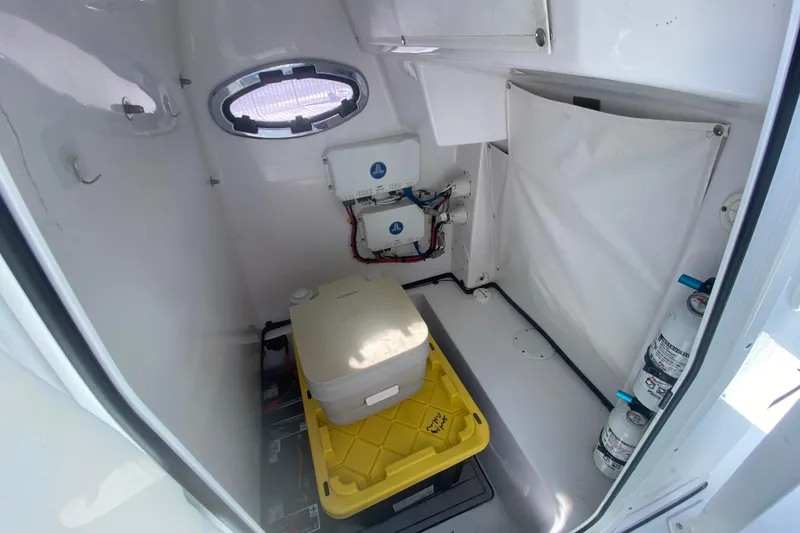 Slide: The Image of Interior of a 2021 Sportsman Masters 267 Bay Boat with storage and equipment. - 17