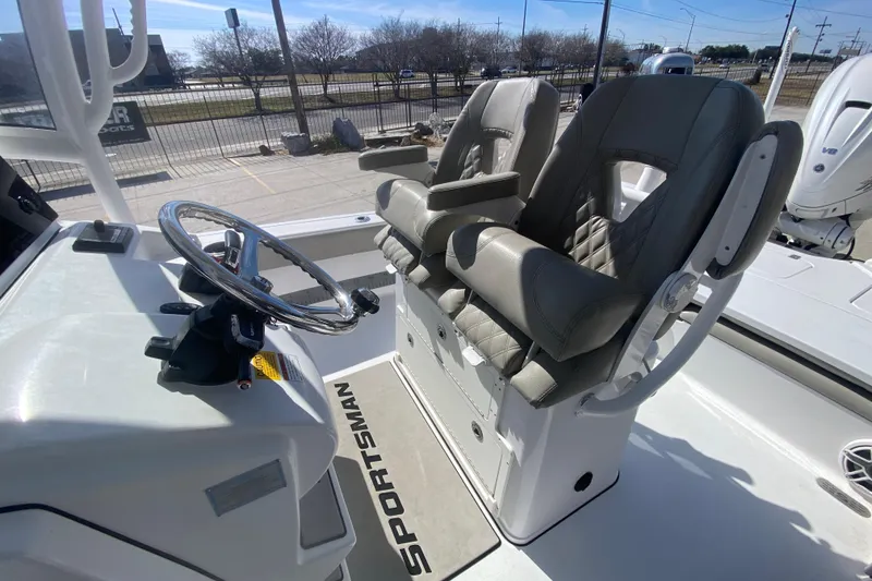 Slide: The Image of 2021 Sportsman Masters 267 Bay Boat helm with dual seats and steering wheel. - 18