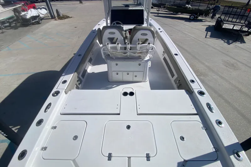 Slide: The Image of 2021 Sportsman Masters 267 Bay Boat interior with seating and storage compartments. - 22
