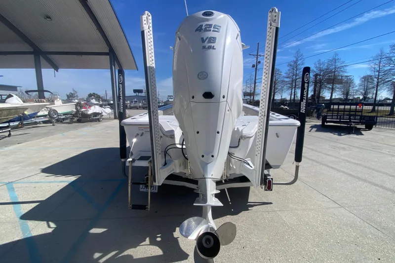 Slide: The Image of 2021 Sportsman Masters 267 Bay Boat with powerful 425 V8 engine, parked outdoors. - 5