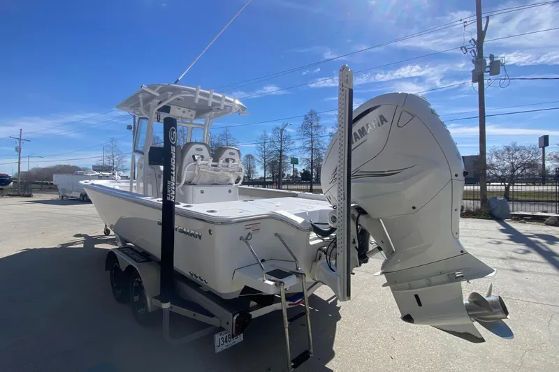 Slide: The Image of 2021 Sportsman Masters 267 Bay Boat with Yamaha engine, parked outdoors under clear blue sky. - 6