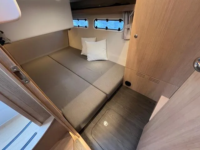 Slide: The Image of 2023 Nimbus 405 Coupé yacht "Crazy Love" cruising on calm waters. - 15