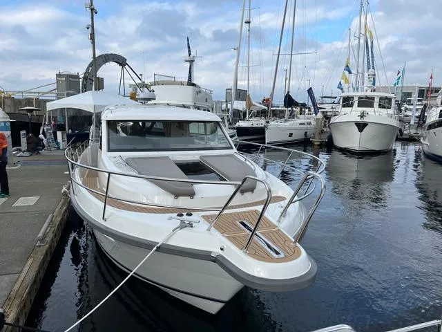 Slide: The Image of 2023 Nimbus 405 Coupé yacht on calm water, featuring sleek design and modern technology. - 3