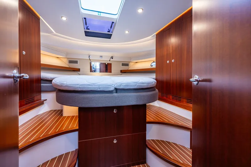 Slide: The Image of Luxurious interior of 2023 Nimbus 405 Coupé yacht with elegant wood finishes. - 33