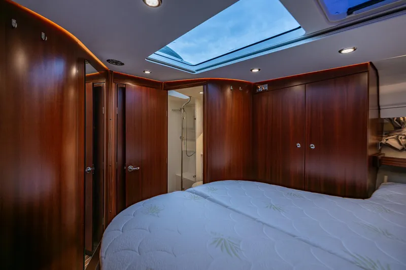 Slide: The Image of Luxurious interior of 2023 Nimbus 405 Coupé yacht with skylight and wooden finishes. - 36