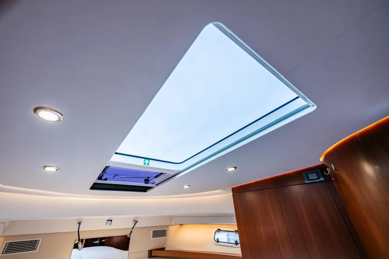Slide: The Image of Interior view of 2023 Nimbus 405 Coupé with skylight and modern lighting. - 37